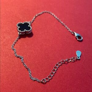 Elegant Silver and Black Clover Bracelet
